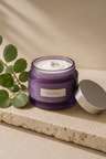 Overnight Botanical Repair cream in a squat glass jar on linen